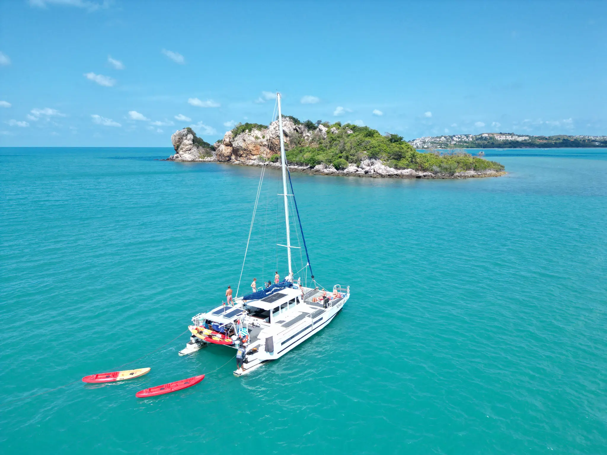 Luxury catamaran with family in turquoise waters