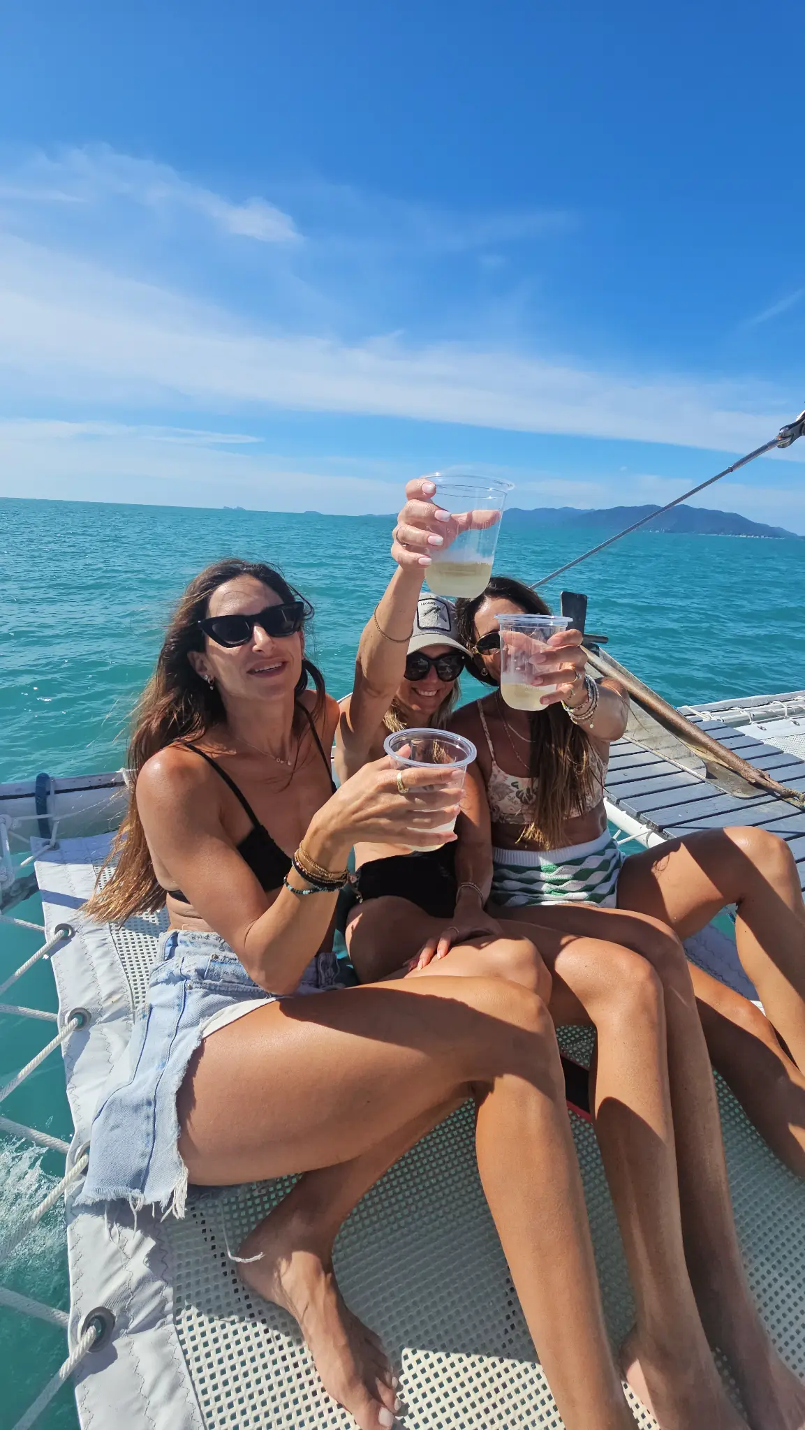 Catamaran anchored at pristine beach